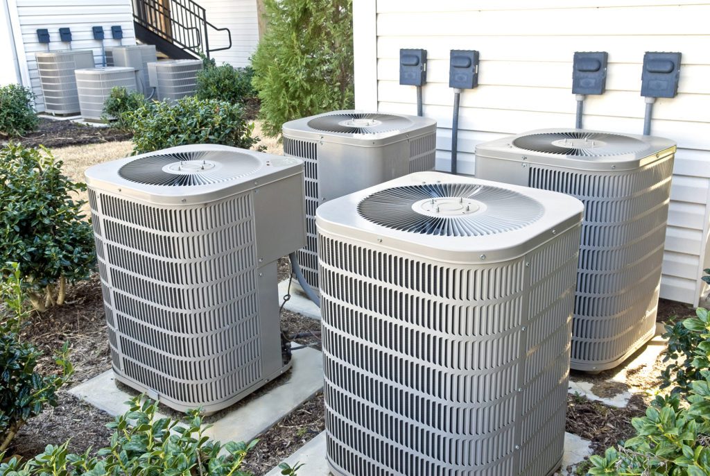 four outdoor furnace installations in square outside home